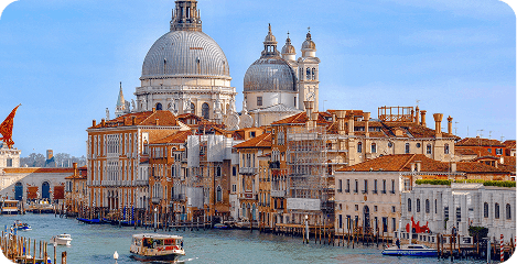 Historic domed cathedral beside a canal in Venice